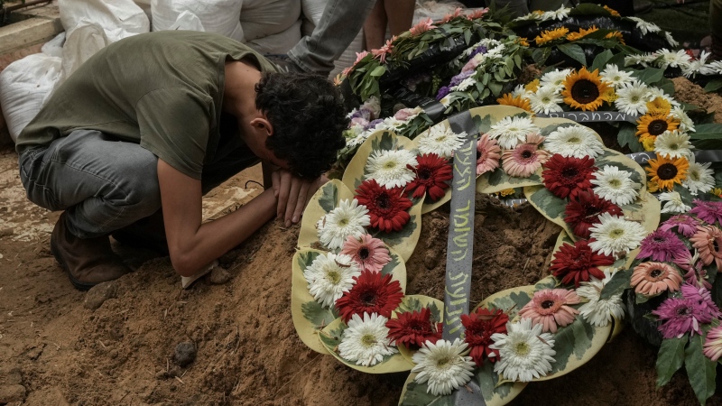 A man mourns during the funeral of Israeli Col. Roi Levy at the Mount Herzl cemetery in Jerusalem on Monday, Oct. 9, 2023. (AP Photo/Maya Alleruzzo)